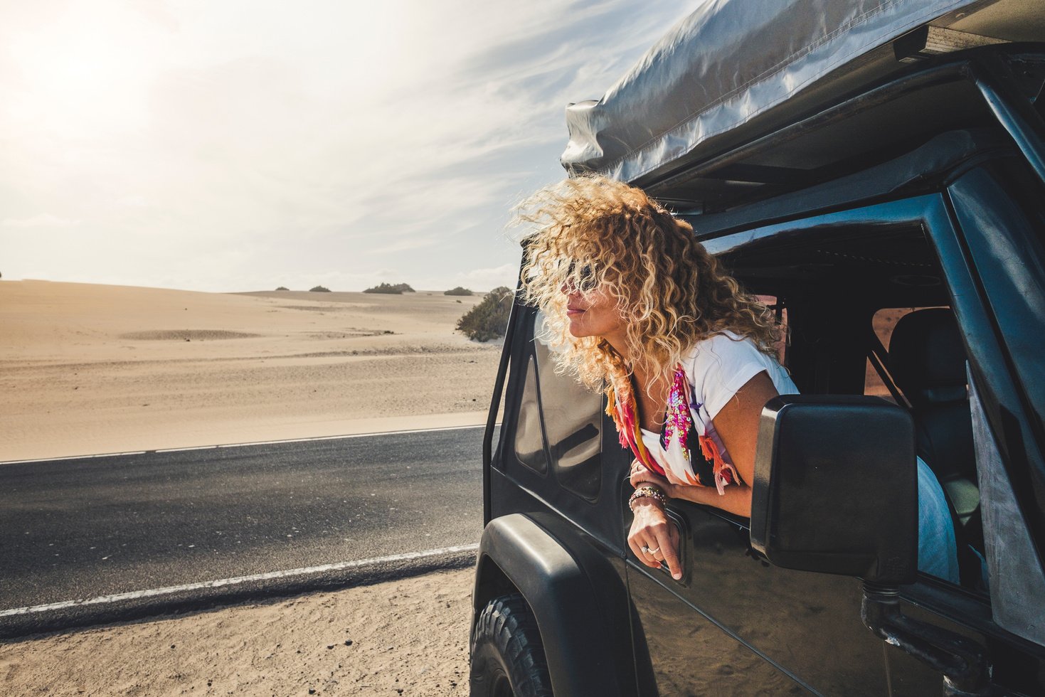 Blonde Curly Hair Woman Head Outside the Window of Car