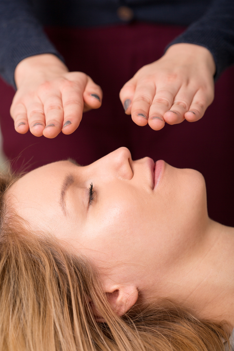 Woman in reiki healing session